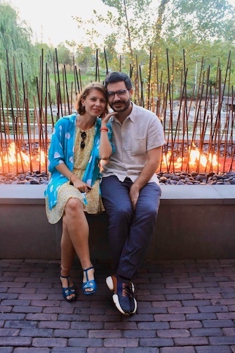 Nina and Chris lounging by the fire pit.